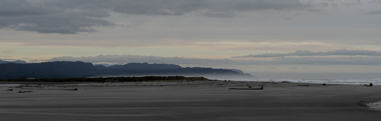 beach ocean hills mountain