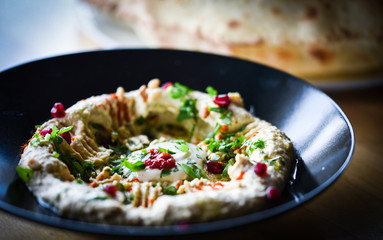 delicious home made lebanese hummus with fresh pomegranate seeds