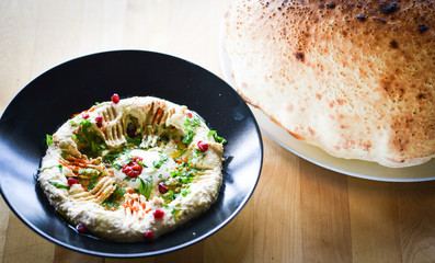 delicious home made lebanese hummus with fresh pomegranate seeds