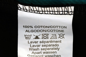 Label with washing instructions. White label with instructions for the composition of the fabric...