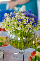 Field daisies and 
chamomiles in a vase