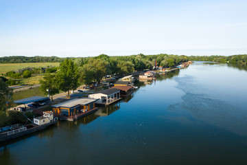 Fototapeta na wymiar Floating houses on Tisza river in Tiszafured, Hungary.