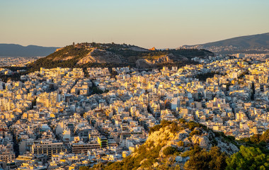 Panoramic sunset view of metropolitan Athens, Greece, with northern residential quarters seen from...