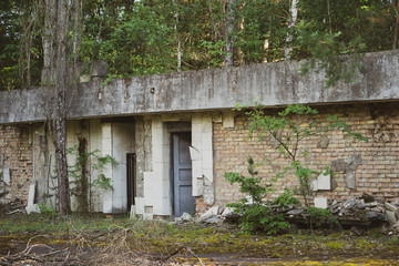 Fototapeta na wymiar Chernobyl, Ukraine Chernobyl exclusion zone. Ruins of abandoned places. Zone of high radioactivity. Ruins of buildings. 