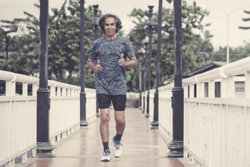 Runners. Young people  running on a city path