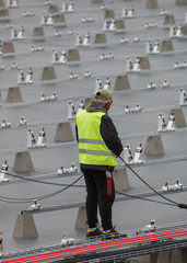 workers on the roof of solar cables installation