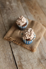 chocolate cupcakes on wooden background