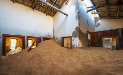 Ruins of a house filled with sand in the mining town Kolmanskop, Namibia