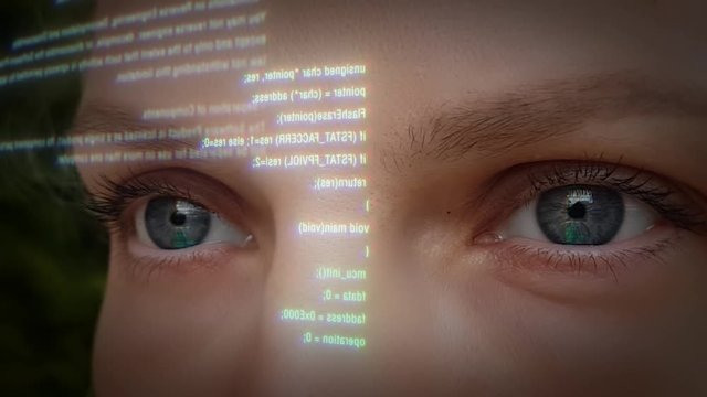 Futuristic women computer worker with code. Eyes close-up and reflection in them.