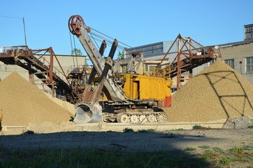 
yellow excavator with a large bucket