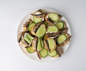 Homemade Sandwiches with Egg, Fresh Cucumber and Sprats. Top view