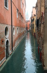 navigable canal with the houses of Venice