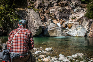 Man Fly Fishing in front of crystal clear pocket water