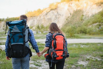 Fototapeta na wymiar happy young couple hiking in mountain