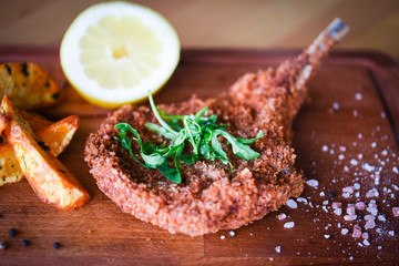 delicious crispy panko pork schnitzel with wedges & fresh pepper
