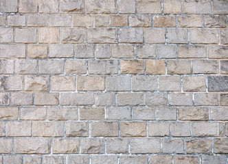 Fototapeta premium Texture of a stone wall. Old castle stone wall texture background. Stone wall as a background or texture. Part of a stone wall, for background or texture