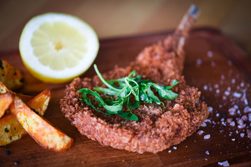 delicious crispy panko pork schnitzel with wedges & fresh pepper