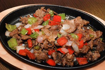 fried beef with green and red bell pepper and onion