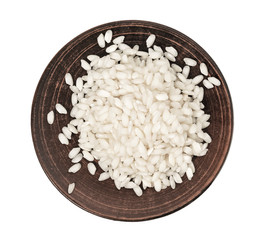 white large rice in a ceramic bowl with a white spoon on a white background