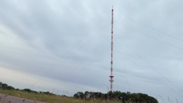 BASE jumper leaping from a communication tower