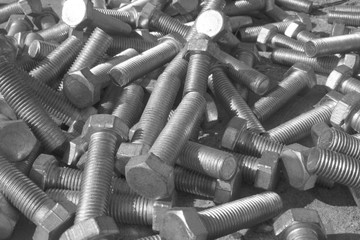 pile of steel bolts in monochrome
