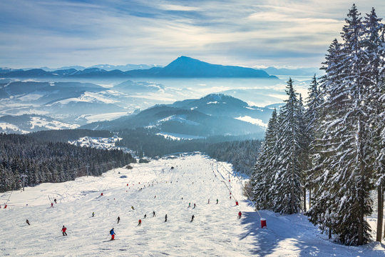 Beautiful scenery of the snowy winter landscape. View from the ski slope of the Kubinska hola resort in Slovakia, Europe.