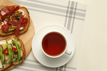 Obraz na płótnie Canvas Breakfast with tea and sandwich