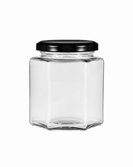 An empty glass jar with a hexagonal shape