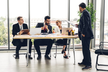 Group of professional business meeting and discussing strategy with new startup project.Creative business people planning and brainstorm with laptop computer in modern office.Teamwork concept