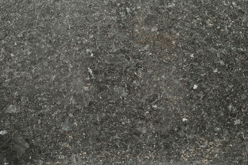Black and white marble texture. Stone tile with natural pattern. Marble pavement closeup. A small marble crumb.
