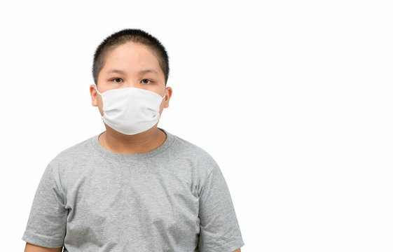 Asian Obese Boy Wearing A Protective Mask To Protect Coronavirus Outbreak