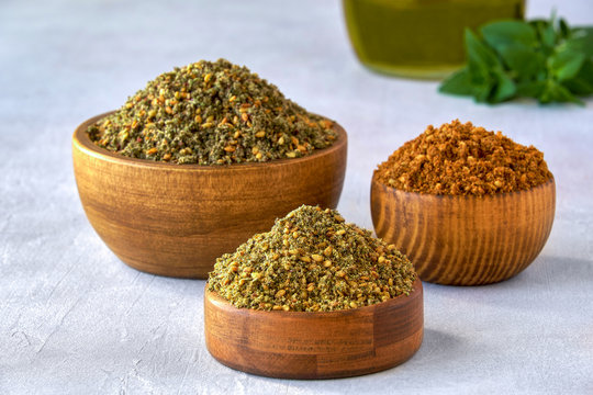 Mixed spice zaatar or zatar in wooden bowls, Various type of zaatar blend. Close up with copy space