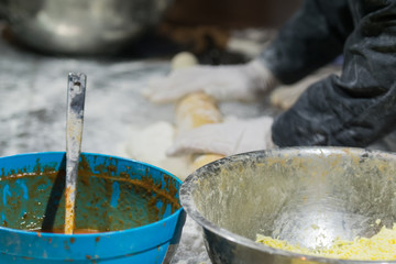 Making dough for bread to be baked.
