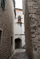 A narrow alley in the old town of sun-drenched
