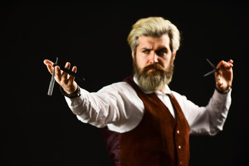 Keep yourself looking groomed all year round. Hipster Barber. Man with beard and moustache. Mature man dyed hair. Vintage barbershop. Barber tools. Trimming or shaving. Barbershop services