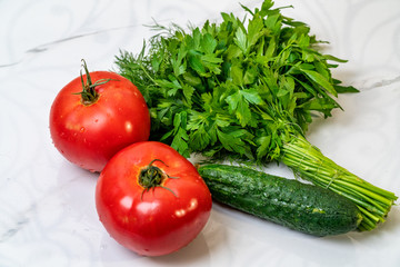 Fresh vegetables. parsley, cucumber, dill, tomato on a white background.