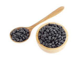 Fototapeta na wymiar Closeup black beans seeds in wooden bowl on white background, healthy food concept