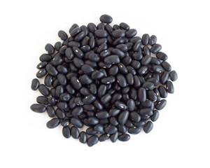 Closeup black beans seeds isolated on white background, healthy food concept
