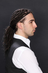 Stylish male model with afro braids posing in studio on isolated background. Style, trends, fashion...
