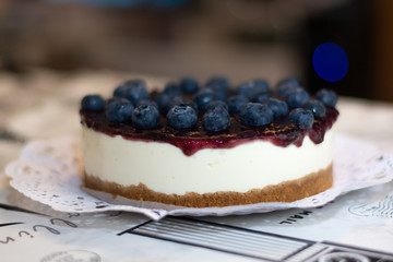 New York cheesecake or classic cheesecake with blueberries. close-up and blur background