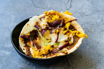 Turkish Mexican Style Taco Cig Kofte with Kidney Beans, Red Onions, Grated Cheddar Cheese and Pomegranate Syrup Sauce.