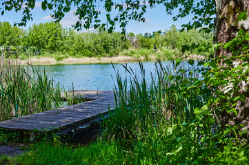 Blue and cloudy sky over a lake in the near of Sperenberg, Germany.