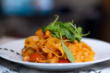 Fettuccine with shrimps recipe: white wine, olive oil, saffron, arugula, chilli, anchovies, garlic, cherry tomatoes, lemon, onion, toamto, shrimps and fettuccine.