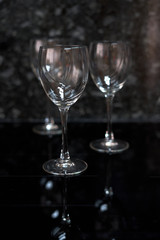 three glass cups on black background