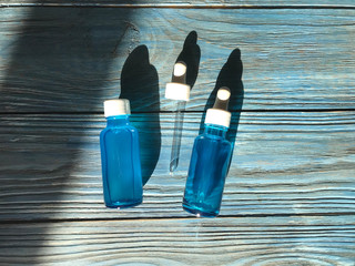 bubble with serum and a dropper in the sunlight. cosmetics for care