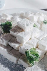 White Homemade Marshmallows with the Mint. Pyramid of Marshmallow. Pile of square Marshmallows.