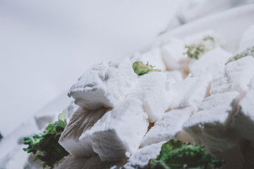 White Homemade Marshmallows with the Mint. Pyramid of Marshmallow. Pile of square Marshmallows.