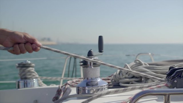 A sailor pulls a rope for some reason in the Mediterranean Sea. Sunny Day, HD