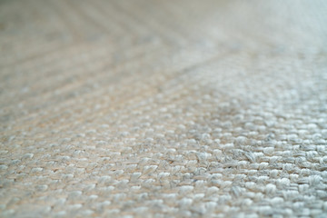 pale jute floor rag background closeup
