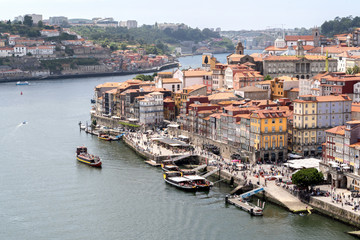 Fototapeta na wymiar Porto, Portugal - 24 June 2019: Waterfront of river Douro in Porto, Portugal.